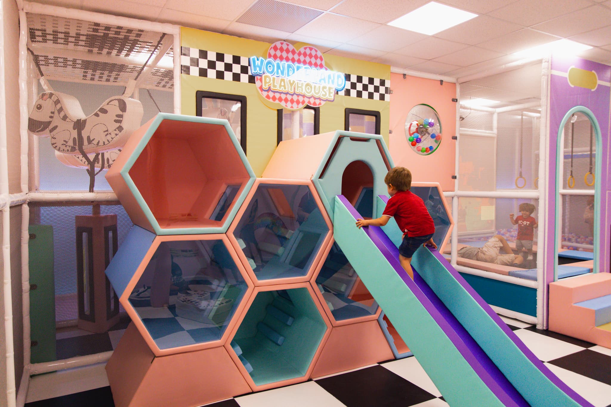 Kid climbing the soft play structure